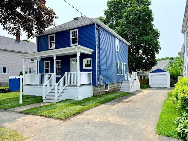 61 Poplar St, Danvers, MA 01923 - american foursquare style home featuring covered porch, an outdoor structure, a detached garage, stairs, and driveway