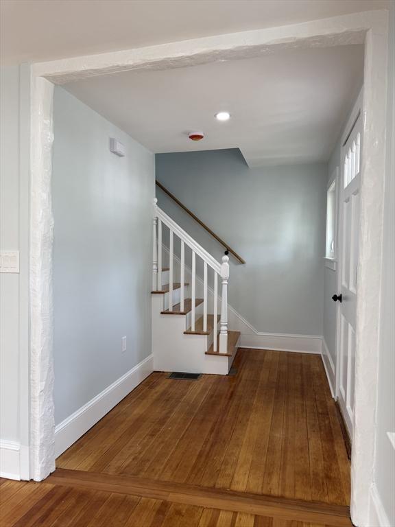 61 Poplar St, Danvers, MA 01923 - stairway featuring hardwood / wood-style flooring and baseboards