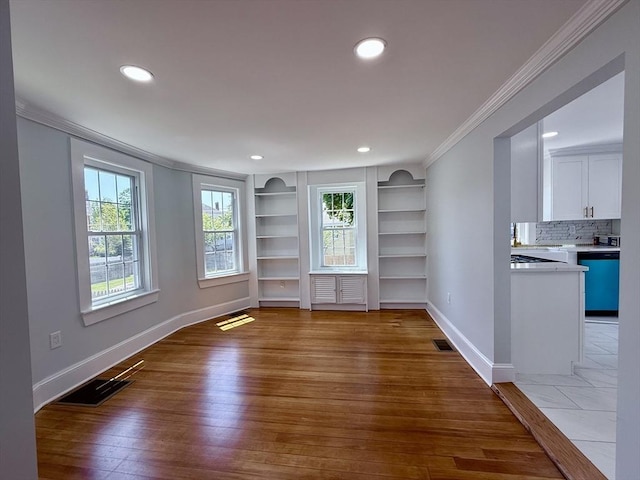61 Poplar St, Danvers, MA 01923 - unfurnished room with ornamental molding, baseboards, hardwood / wood-style floors, recessed lighting, and built in shelves