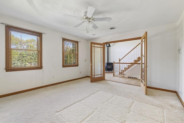 27 Sullivan Blvd, Oxford, MA 01540 - unfurnished room featuring light colored carpet, baseboards, a ceiling fan, and stairs