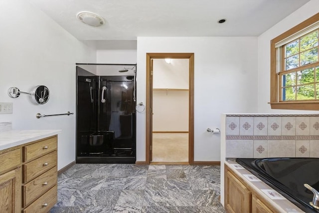 27 Sullivan Blvd, Oxford, MA 01540 - full bath featuring baseboards, a bath, vanity, and a spacious closet