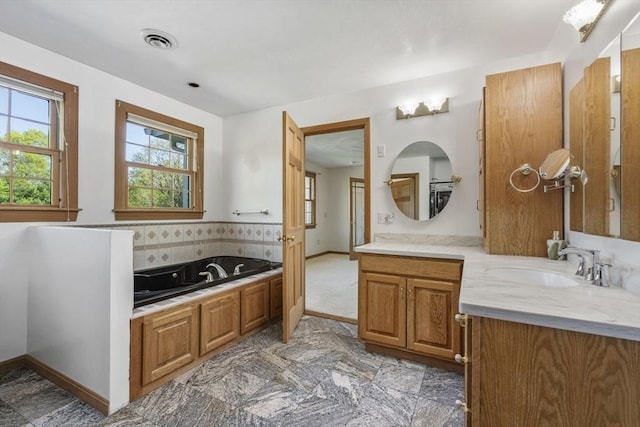 27 Sullivan Blvd, Oxford, MA 01540 - full bath with a bath, vanity, baseboards, and tasteful backsplash