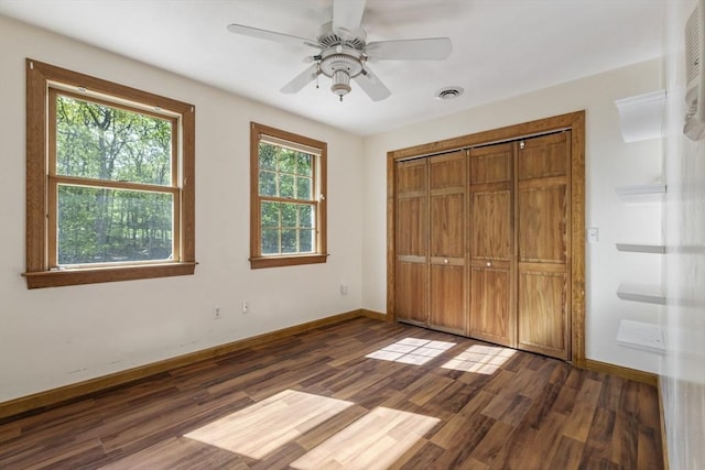 27 Sullivan Blvd, Oxford, MA 01540 - unfurnished bedroom with dark wood-type flooring, baseboards, a closet, and a ceiling fan