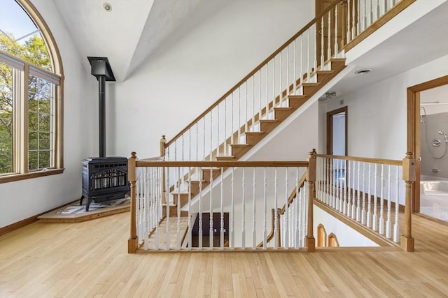 27 Sullivan Blvd, Oxford, MA 01540 - stairway featuring hardwood / wood-style floors, healthy amount of natural light, a wood stove, and baseboards