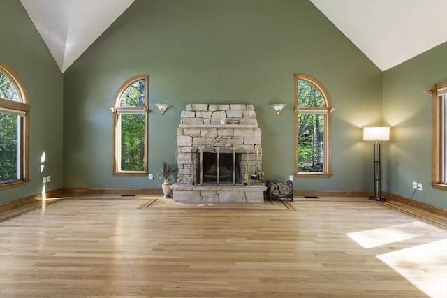27 Sullivan Blvd, Oxford, MA 01540 - unfurnished living room featuring high vaulted ceiling, healthy amount of natural light, wood finished floors, and a fireplace