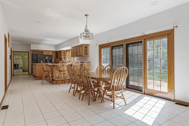 27 Sullivan Blvd, Oxford, MA 01540 - dining space featuring light tile patterned floors and baseboards