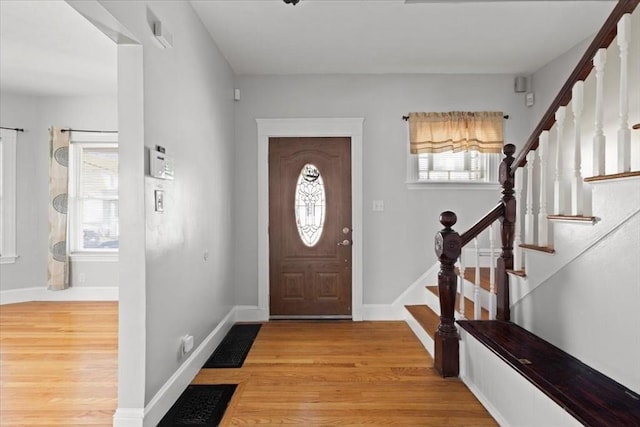 entrance foyer featuring light hardwood / wood-style flooring and plenty of natural light