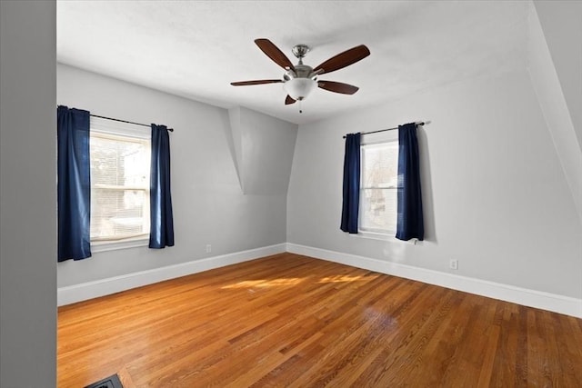 unfurnished room featuring hardwood / wood-style flooring and ceiling fan