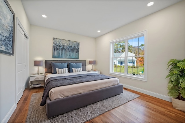 bedroom with hardwood / wood-style flooring