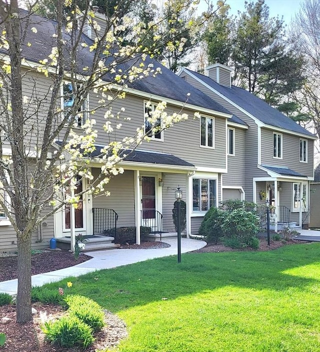 15 Iris Way Unit 27, Haverhill, MA 01830 - view of front facade with a front lawn and a chimney