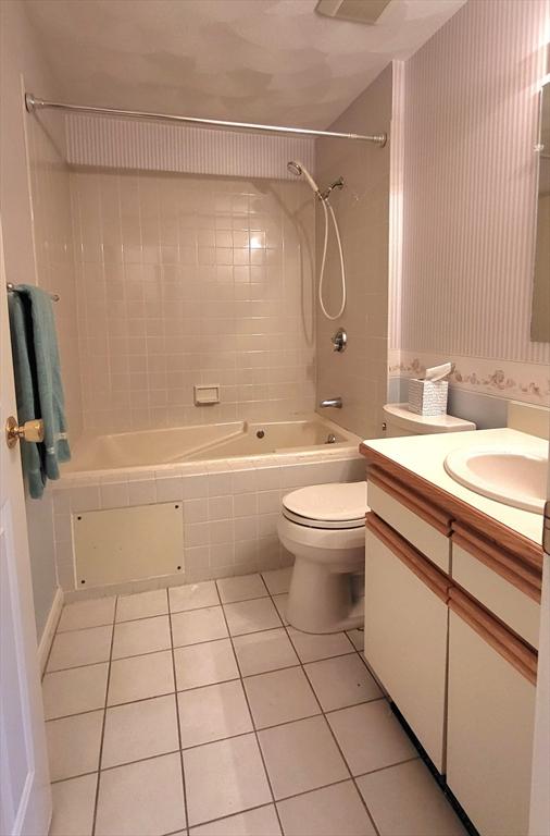 15 Iris Way Unit 27, Haverhill, MA 01830 - bathroom with tile patterned floors, shower / bathtub combination, toilet, and vanity
