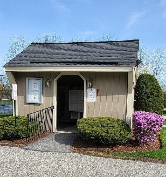 15 Iris Way Unit 27, Haverhill, MA 01830 - property entrance featuring a shingled roof and fence