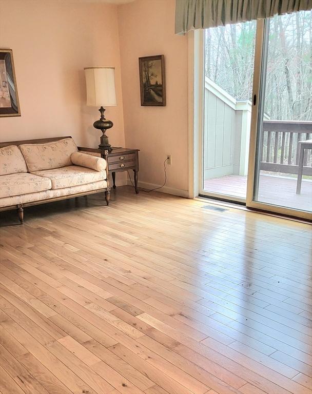 15 Iris Way Unit 27, Haverhill, MA 01830 - living area featuring light wood-type flooring and baseboards