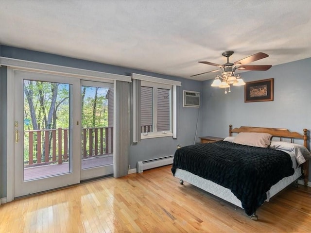 44 Casablanca Ct Unit 44, Haverhill, MA 01832 - bedroom with a baseboard heating unit, access to outside, wood-type flooring, and baseboards