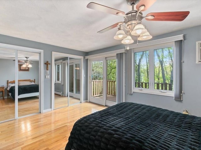 44 Casablanca Ct Unit 44, Haverhill, MA 01832 - bedroom with access to outside, wood finished floors, multiple closets, baseboard heating, and a ceiling fan