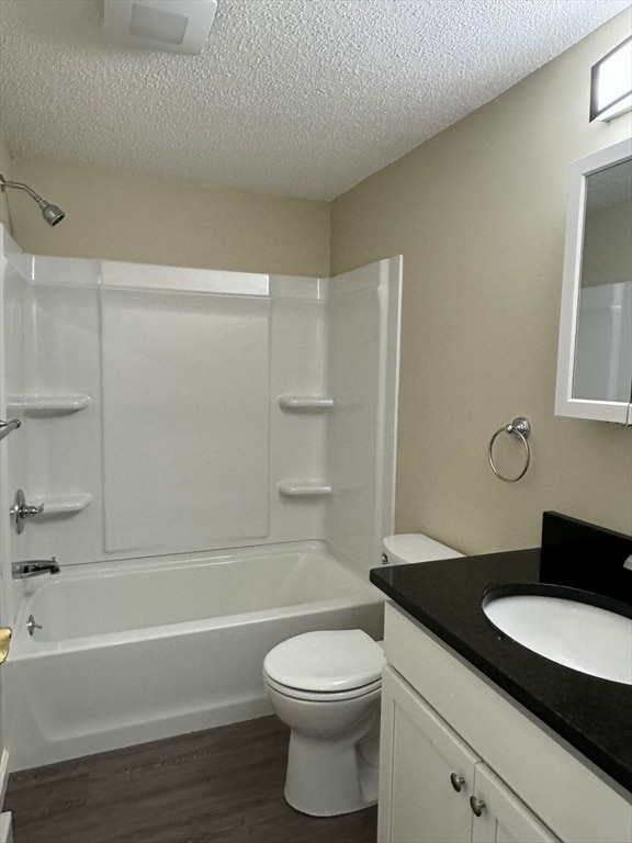 full bathroom featuring tub / shower combination, vanity, toilet, and hardwood / wood-style flooring