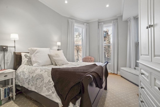 bedroom featuring light wood-type flooring and ornamental molding