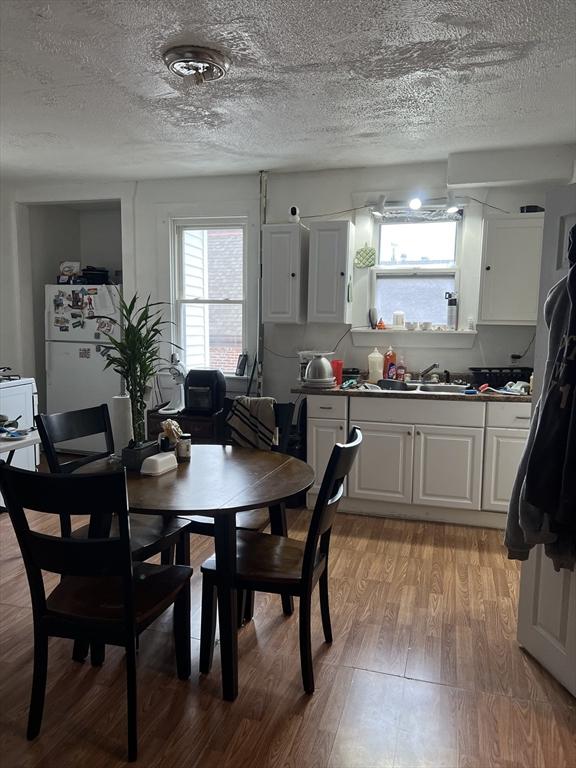 dining room with light hardwood / wood-style floors and sink