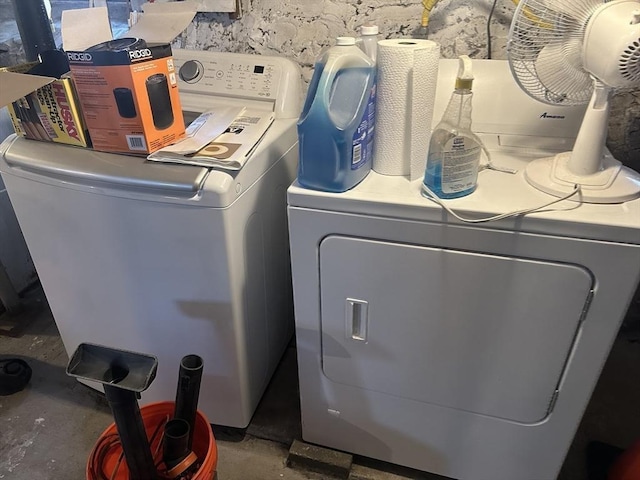 clothes washing area featuring washer / clothes dryer