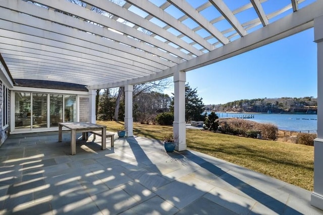 view of patio / terrace with a water view and a pergola