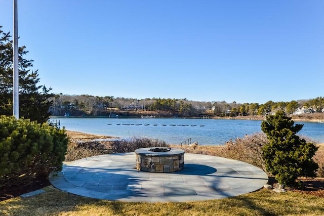 property view of water with a fire pit