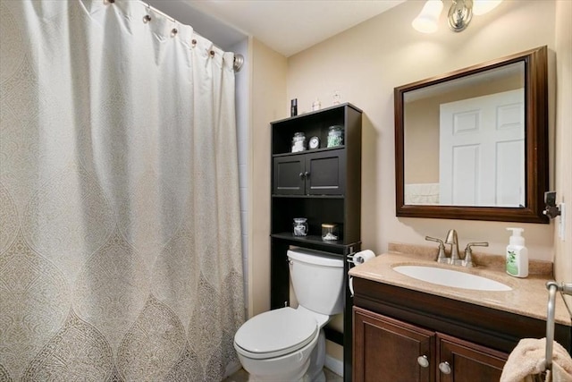 full bath with toilet and vanity