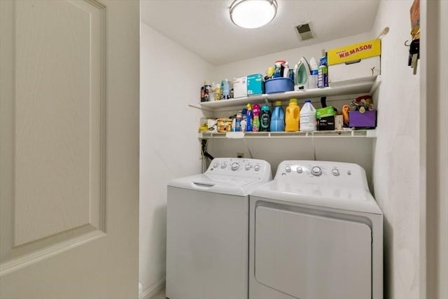 laundry area with independent washer and dryer