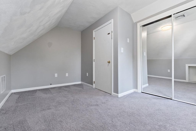 additional living space with lofted ceiling, carpet, and baseboards