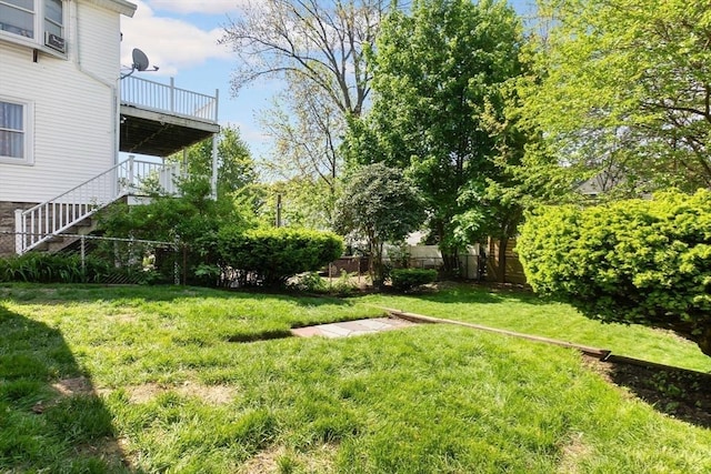 view of yard featuring stairway