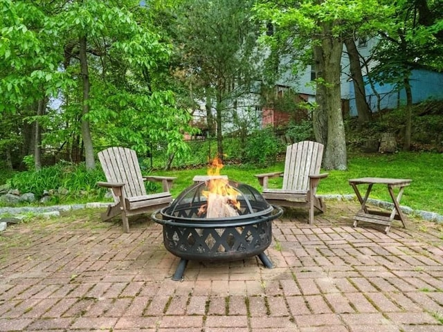49 Fern Rd, Medford, MA 02155 - view of patio featuring an outdoor fire pit