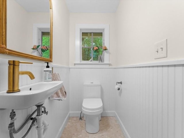 49 Fern Rd, Medford, MA 02155 - half bath with a wainscoted wall and toilet