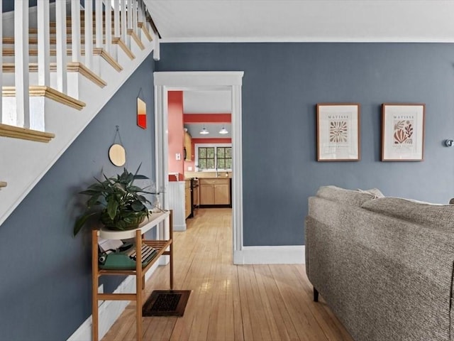 49 Fern Rd, Medford, MA 02155 - hallway featuring hardwood / wood-style floors, stairs, baseboards, and ornamental molding
