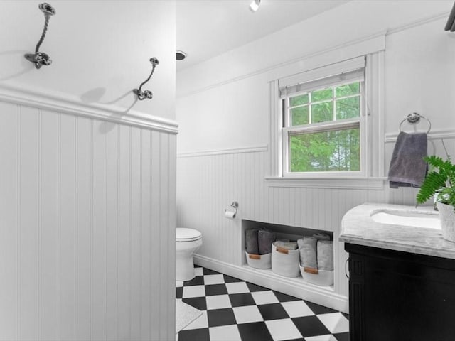49 Fern Rd, Medford, MA 02155 - full bathroom with a wainscoted wall, tile patterned floors, vanity, and toilet