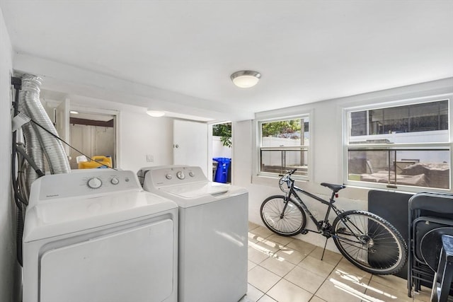 281 Chelsea St Unit 2A, Boston, MA 02128 - laundry room with washing machine and dryer and light tile patterned floors