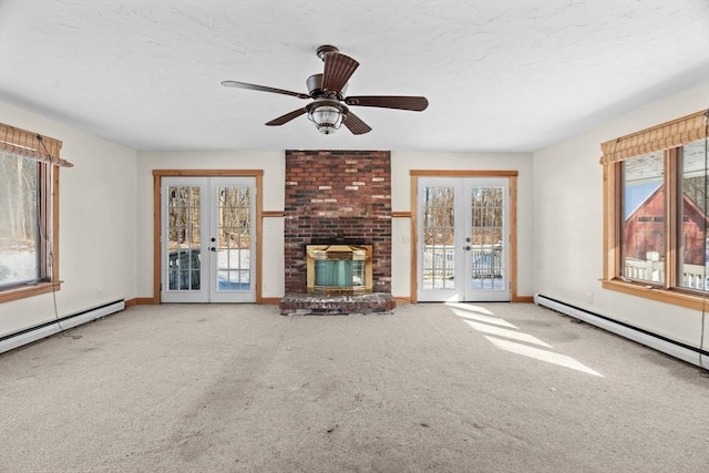 1210 Highland St, Holliston, MA 01746 - unfurnished living room with french doors, carpet floors, baseboard heating, a textured ceiling, and ceiling fan