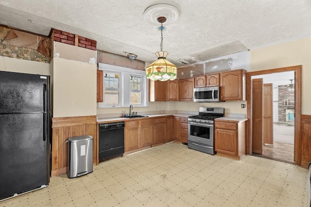 1210 Highland St, Holliston, MA 01746 - kitchen featuring black appliances, light flooring, light countertops, a textured ceiling, and hanging light fixtures