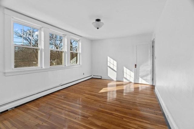 1210 Highland St, Holliston, MA 01746 - spare room featuring baseboard heating and wood-type flooring