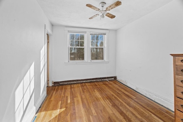 1210 Highland St, Holliston, MA 01746 - empty room featuring a ceiling fan and wood finished floors