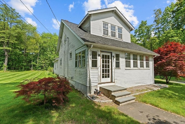 1210 Highland St, Holliston, MA 01746 - view of front of house featuring a front lawn and roof with shingles