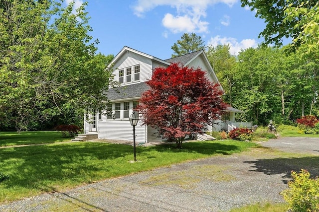 1210 Highland St, Holliston, MA 01746 - view of front of property featuring a front lawn, a shingled roof, and entry steps