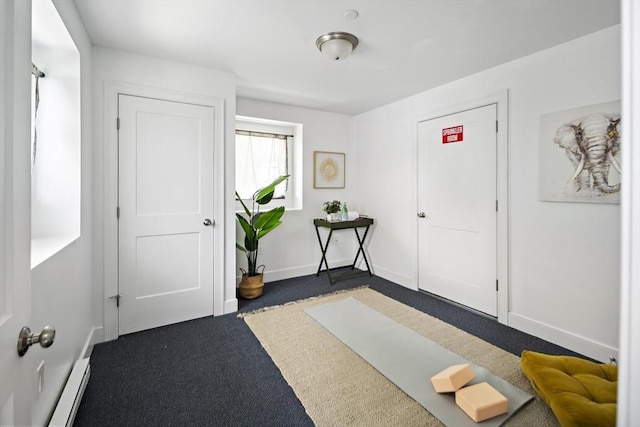 9 Cedar St Unit 1, Boston, MA 02119 - entrance foyer featuring dark colored carpet, baseboards, and baseboard heating