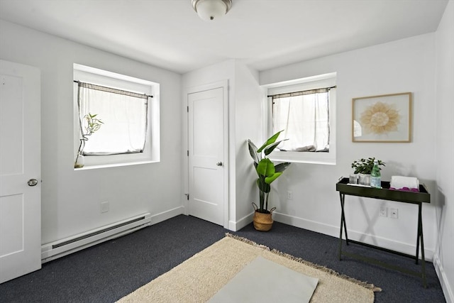 9 Cedar St Unit 1, Boston, MA 02119 - entrance foyer featuring a baseboard heating unit, dark carpet, and baseboards