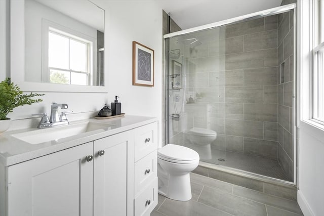 9 Cedar St Unit 1, Boston, MA 02119 - full bathroom featuring toilet, vanity, a stall shower, and tile patterned flooring