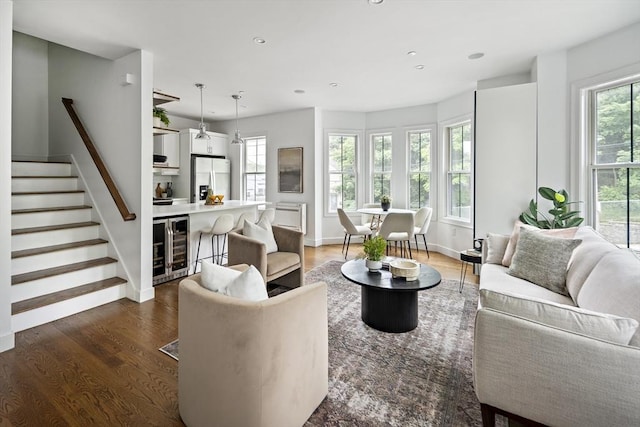 9 Cedar St Unit 1, Boston, MA 02119 - living room featuring beverage cooler, healthy amount of natural light, wood finished floors, recessed lighting, and stairs