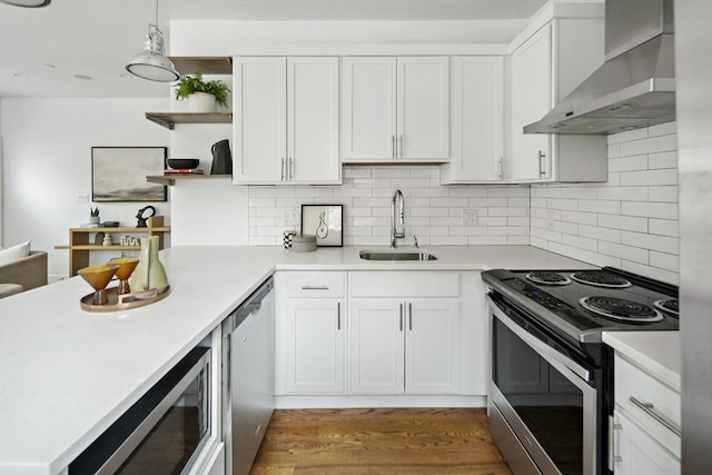 9 Cedar St Unit 1, Boston, MA 02119 - kitchen with appliances with stainless steel finishes, wall chimney exhaust hood, open shelves, a sink, and light countertops