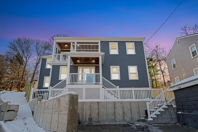 view of front of property with a balcony and a porch