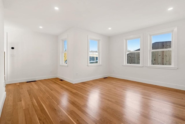 unfurnished room featuring light hardwood / wood-style flooring