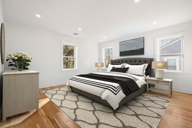 bedroom with light hardwood / wood-style flooring