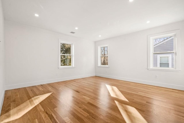 unfurnished room featuring hardwood / wood-style flooring