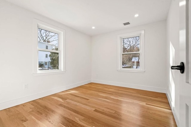 empty room featuring hardwood / wood-style floors